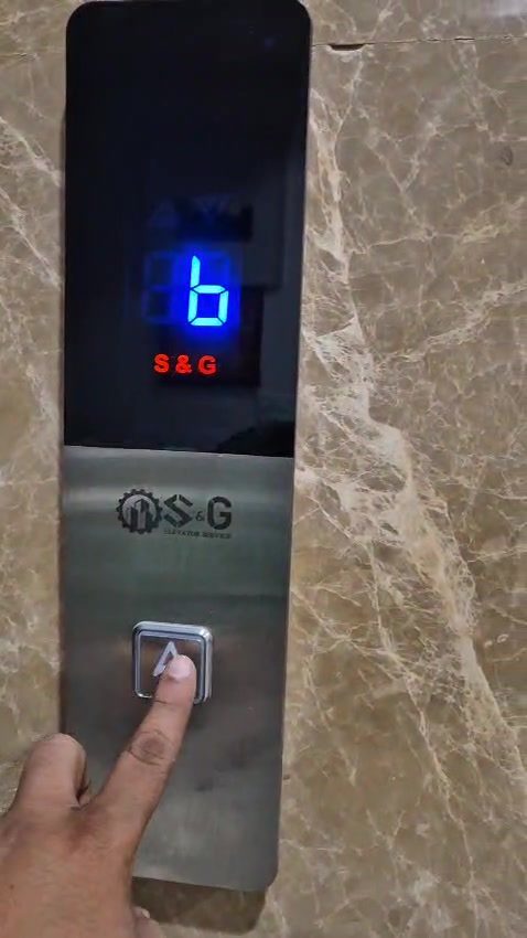 S&G Elevator Service engineer repairing a lift